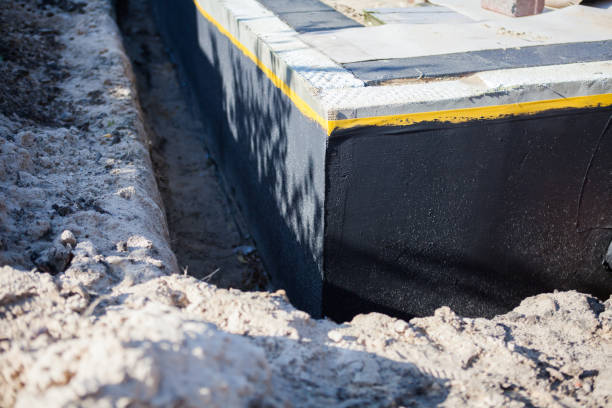 Professional Waterproofing technician working in Lockport, NY
